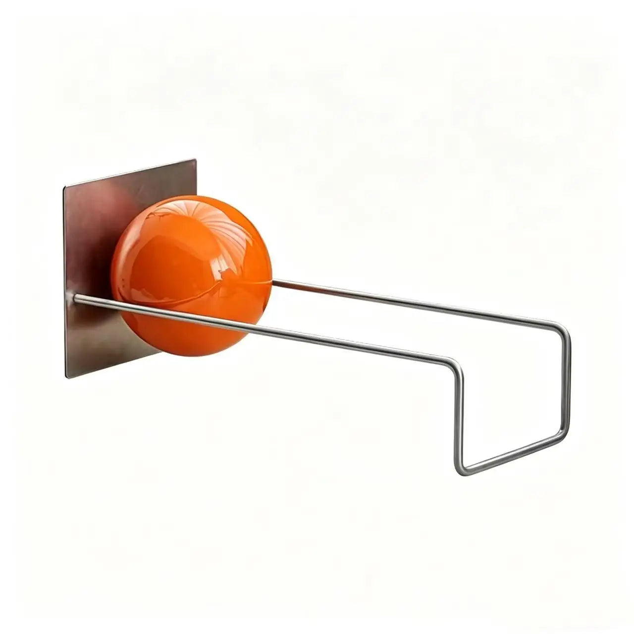 Modern metal desktop bookshelf with orange decorative sphere holding books on a contemporary white desk.