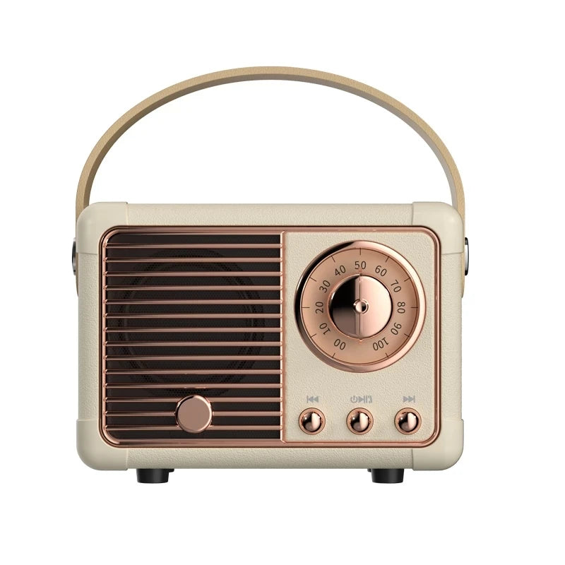 A retro-style portable radio with a cream-colored textured body, rose gold metallic controls and handle, and a dark brown speaker grille, shown on a plain white background.