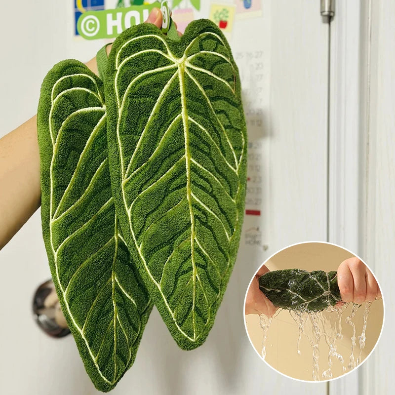 Green leaf-shaped hand towel with a close-up of water droplets on a white background