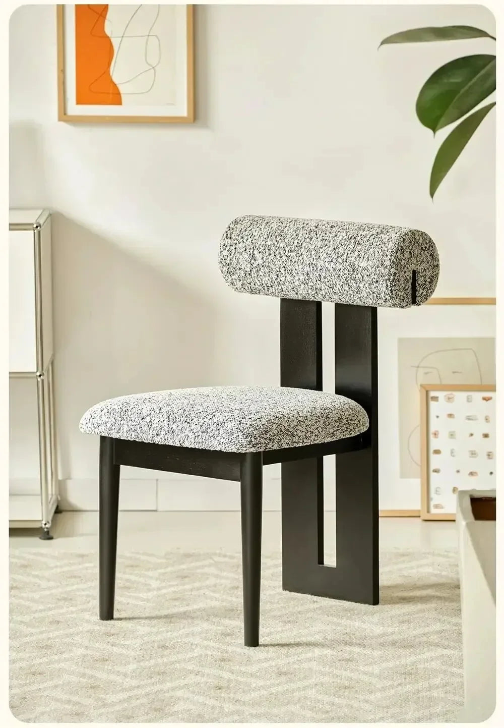 Modern chair with textured seat and backrest in a room with decor elements.