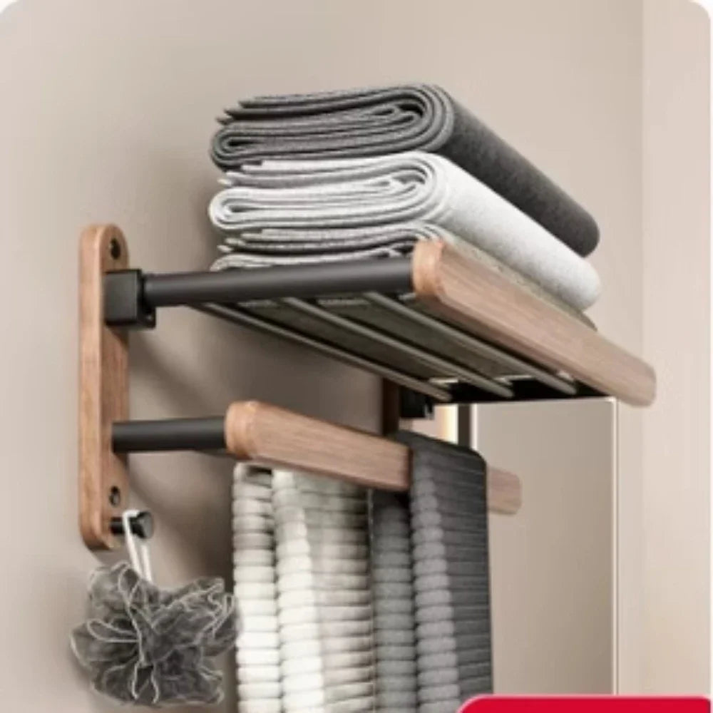 Towel rack with folded towels on a neutral background