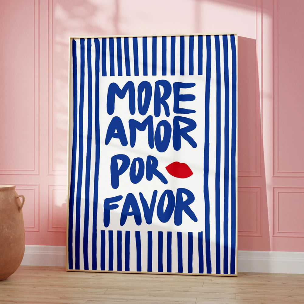 Framed artwork with 'More Amor Por Favor' text on a striped background in a room.