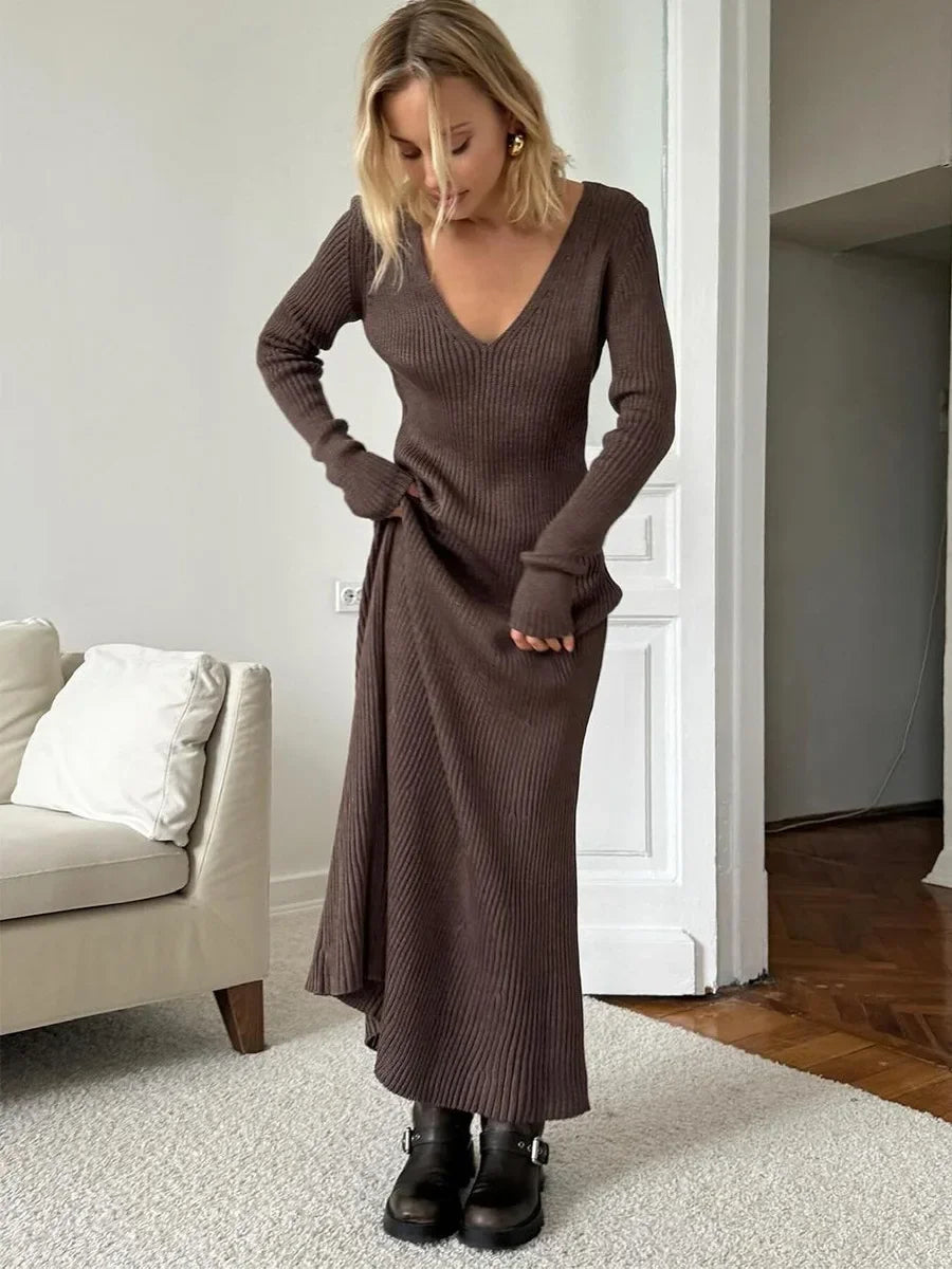 Woman wearing a cream ribbed knitted maxi dress with V-neck and long sleeves, Blubelle fashion in Brown