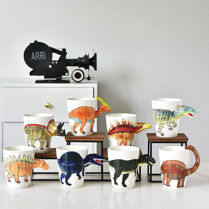 Collection of dinosaur-themed mugs on a white surface with a gray background.