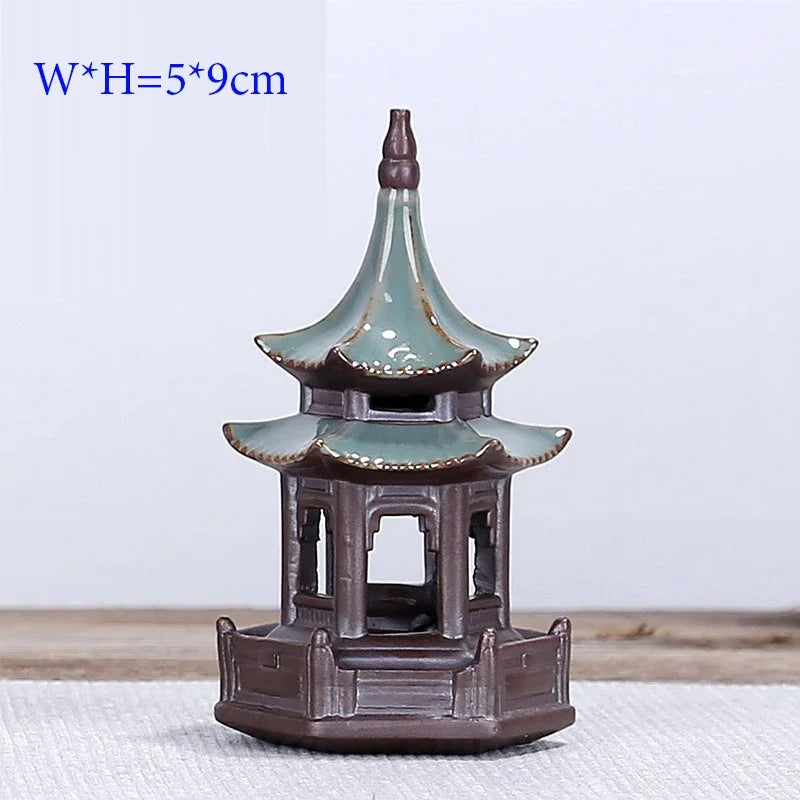 Ceramic pagoda incense burner on a white background