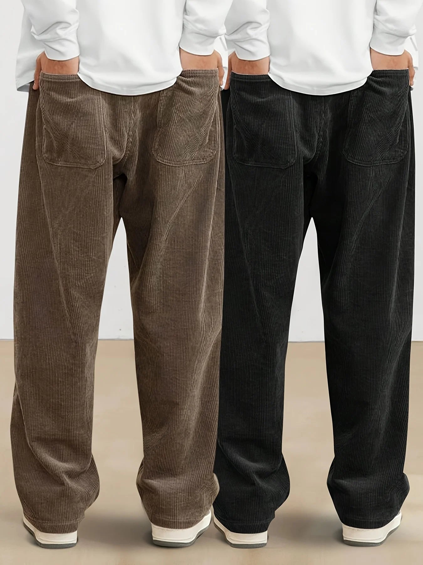 Two pairs of corduroy pants, one brown and one black, worn by models against a plain background.