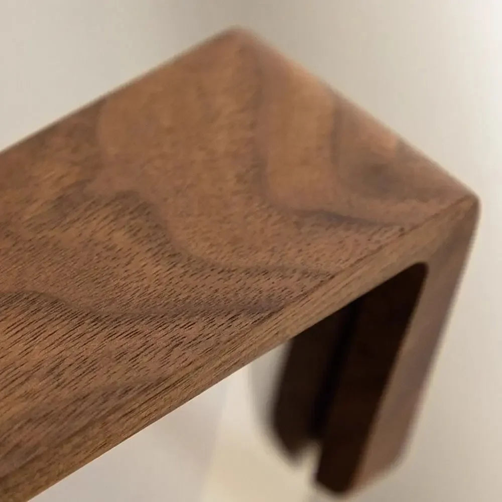 Close-up of a wooden frame with a plain background