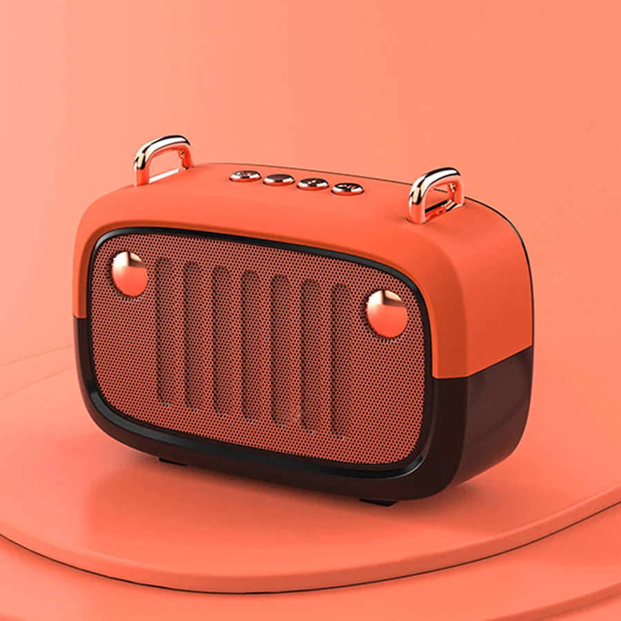 Orange retro-style portable speaker on an orange background
