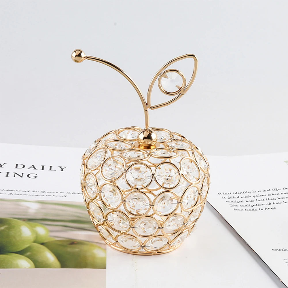 Decorative gold apple-shaped decorative item on a magazine