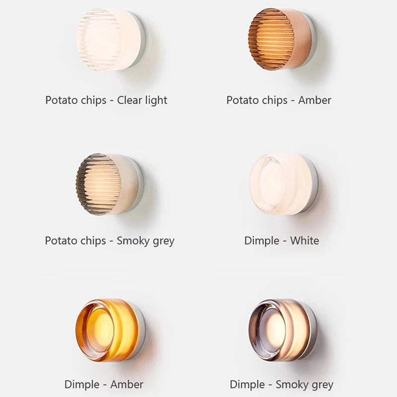 Various wall lights with different color options on a white background