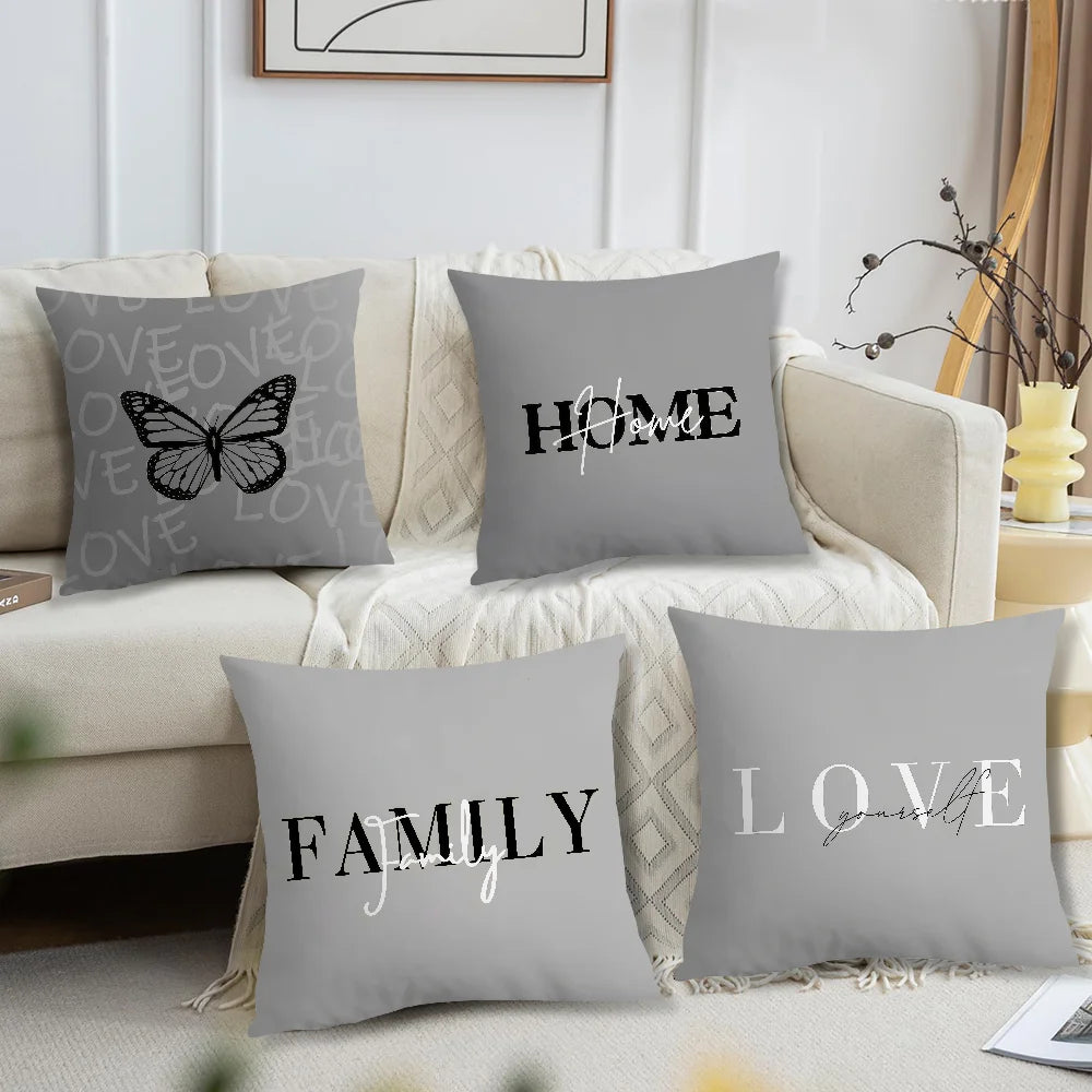Grey and white decorative cushion covers with Family, Home, Love and butterfly designs