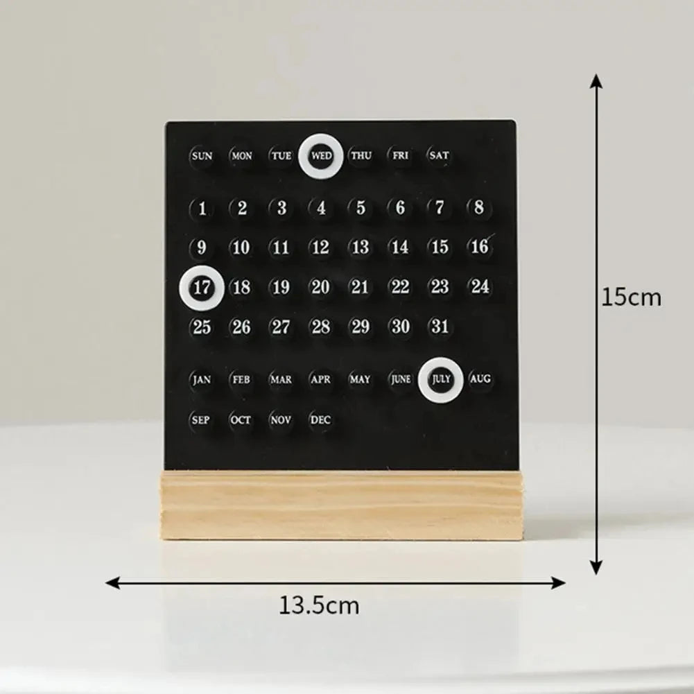 Black digital calendar with wooden base and measurements on a white background