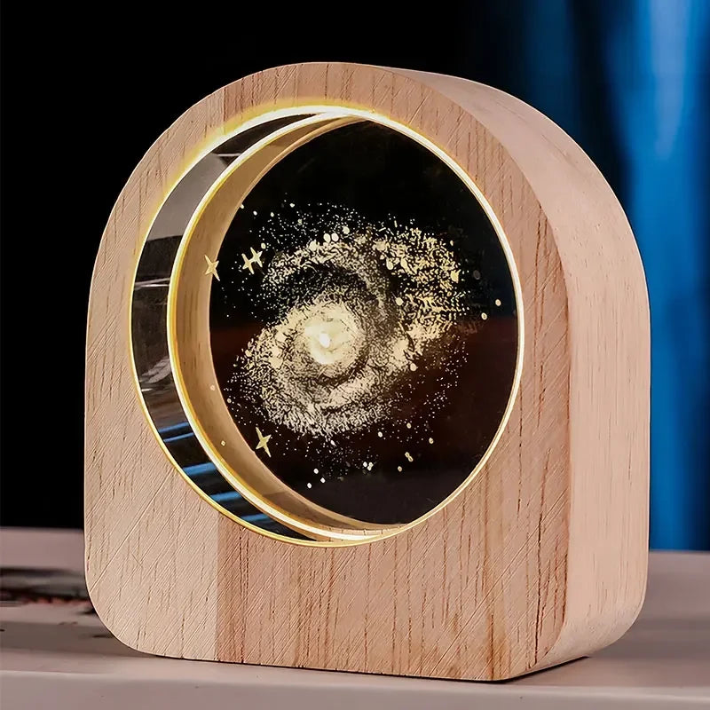 3D crystal glass solar system ball with laser engraved astronomy design displayed as desktop decoration