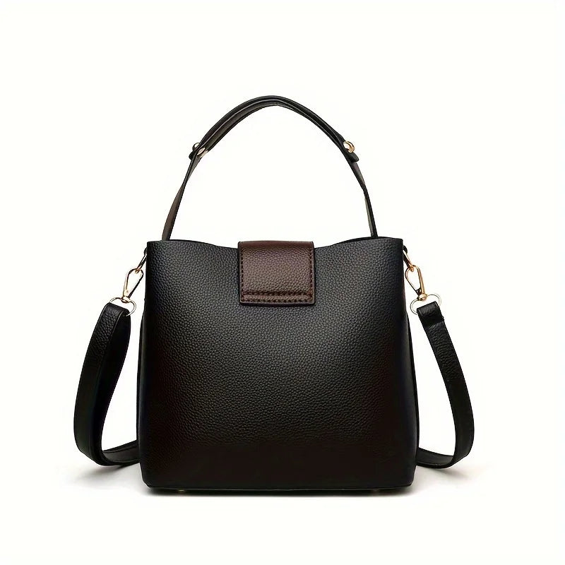 Black handbag with a brown patch on a white background