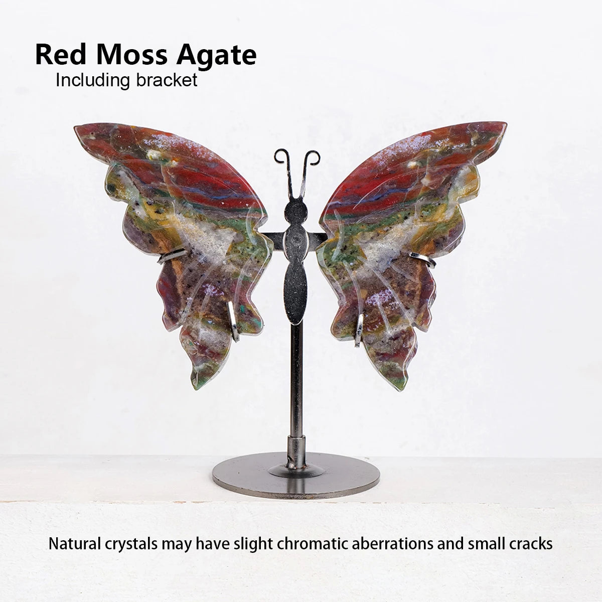 Butterfly-shaped red moss agate on a stand with text about natural crystals.