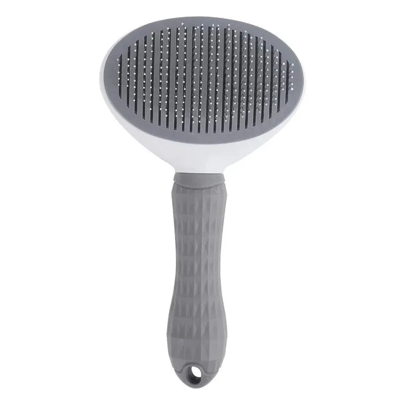 Gray pet grooming brush on a white background