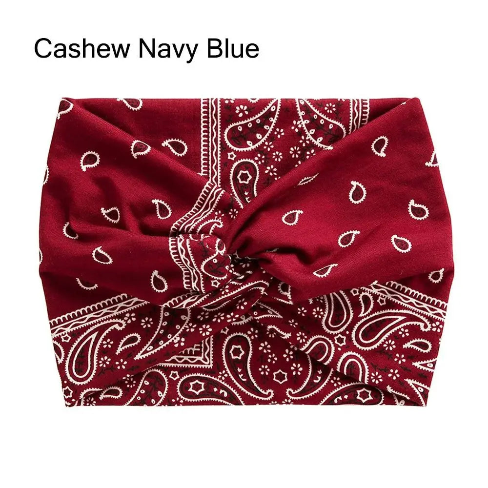 Red bandana with white paisley patterns on a white background, labeled 'Cashew Navy Blue'.