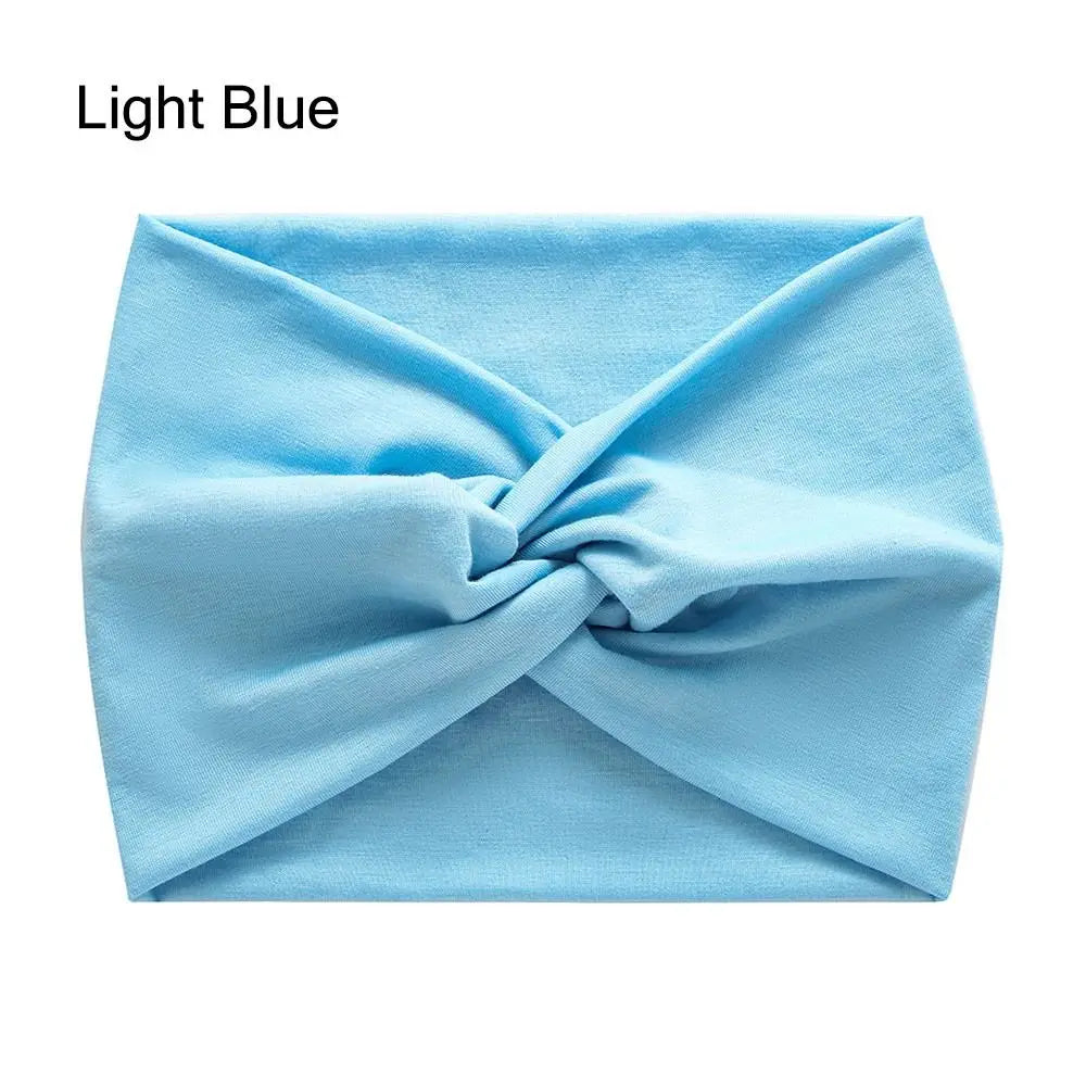 Light blue headband with a knot on a white background