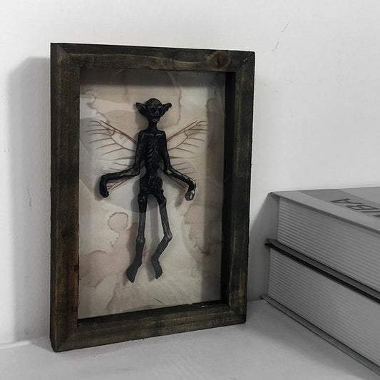 Gothic fairy skeleton shadow box decor with vintage style frame and dark academia aesthetic