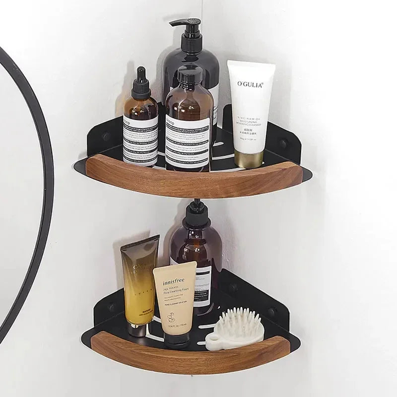 Corner shower caddy with various bottles and a brush on a white background