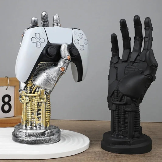 Robot hand and mechanical arm sculpture on a wooden surface with a gray background