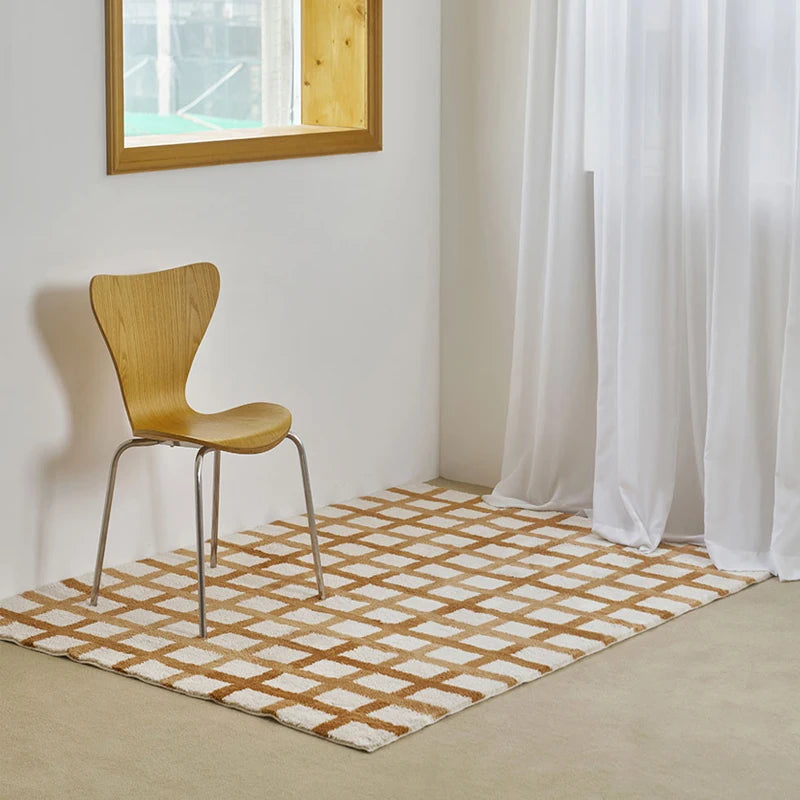 Wooden chair on a checkered rug in a room with white walls and curtains.