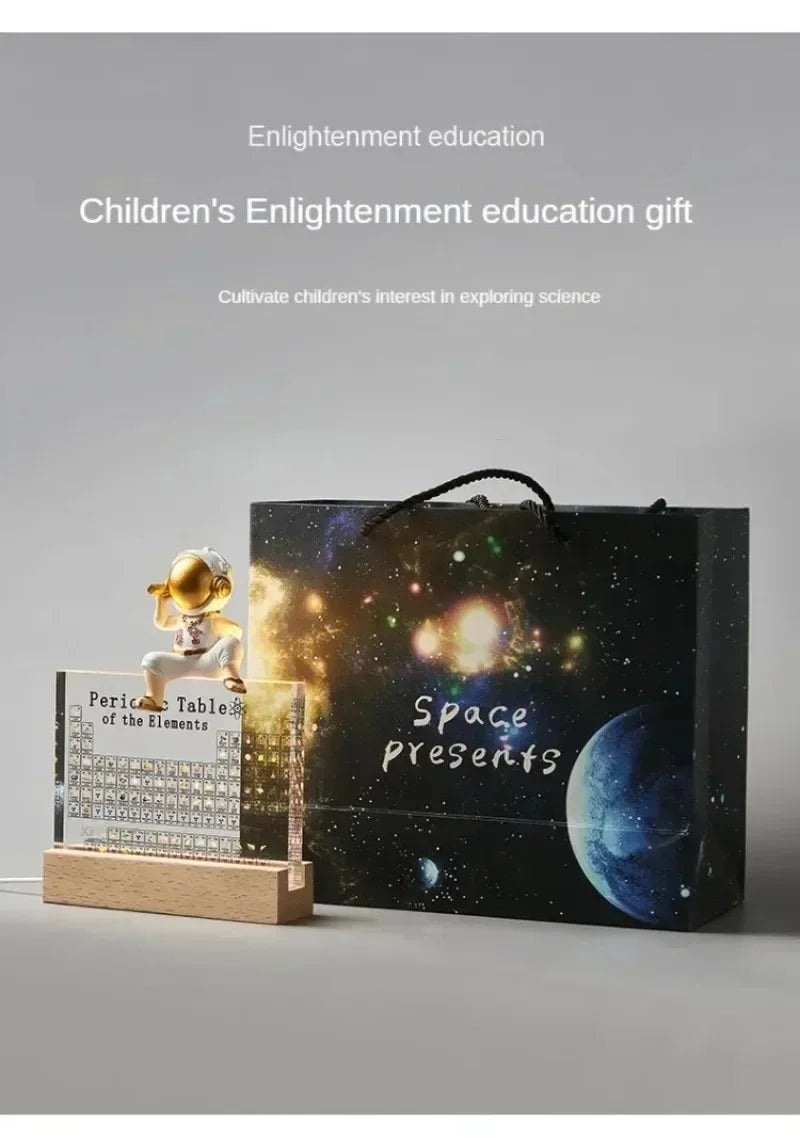 Children's enlightenment education gift set with a space-themed box and educational item on a gray background.