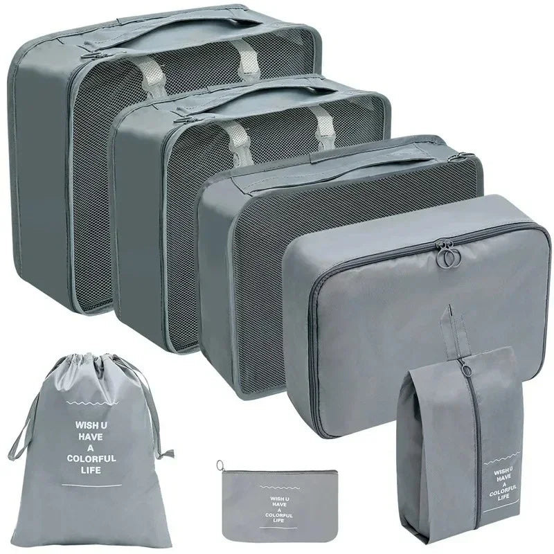 Set of gray packing cubes and bags with text on a white background
