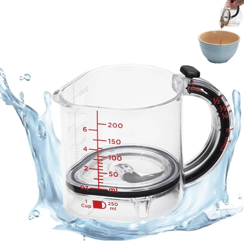 Clear measuring cup with red measurement markings on a white background
