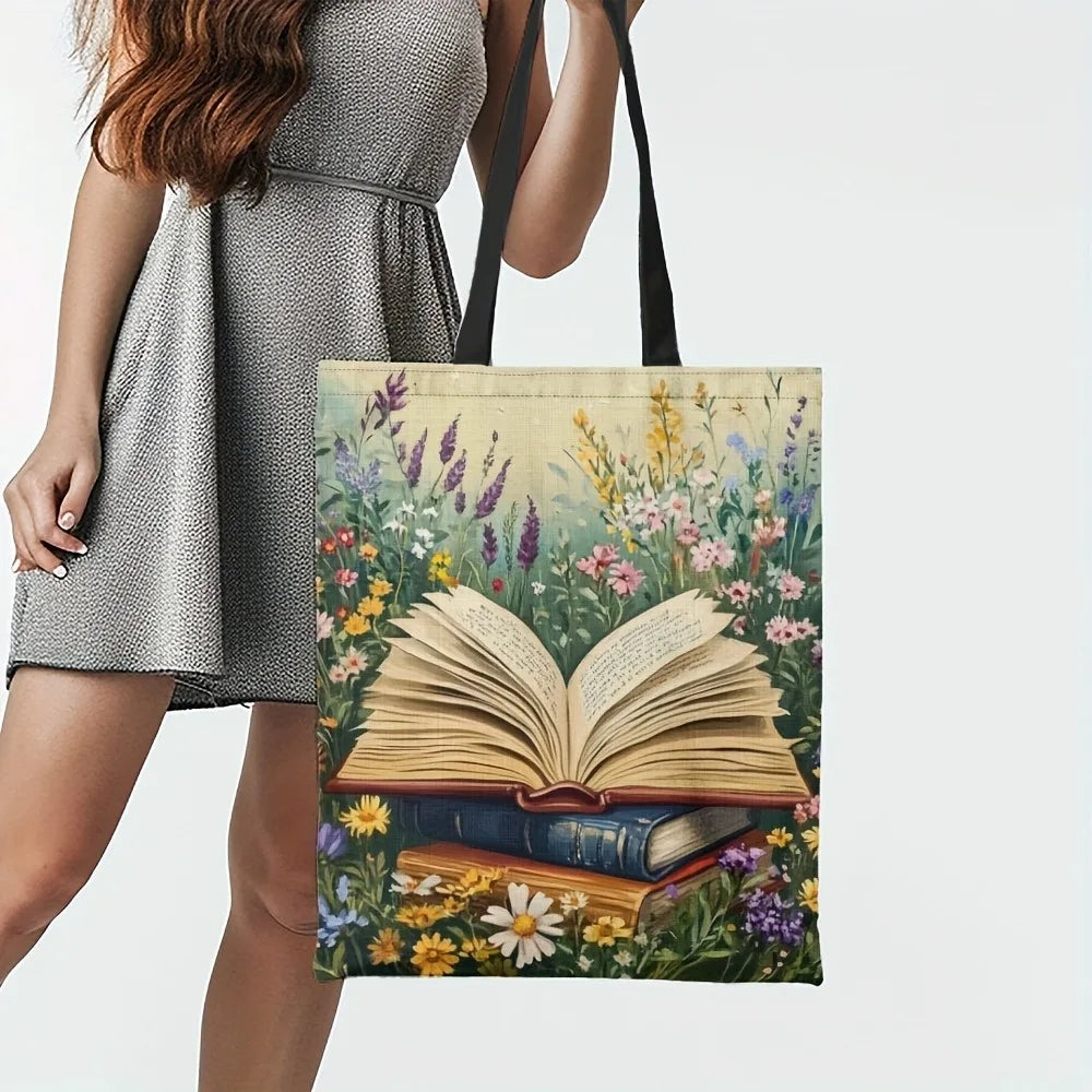 Woman holding a tote bag with floral and book design