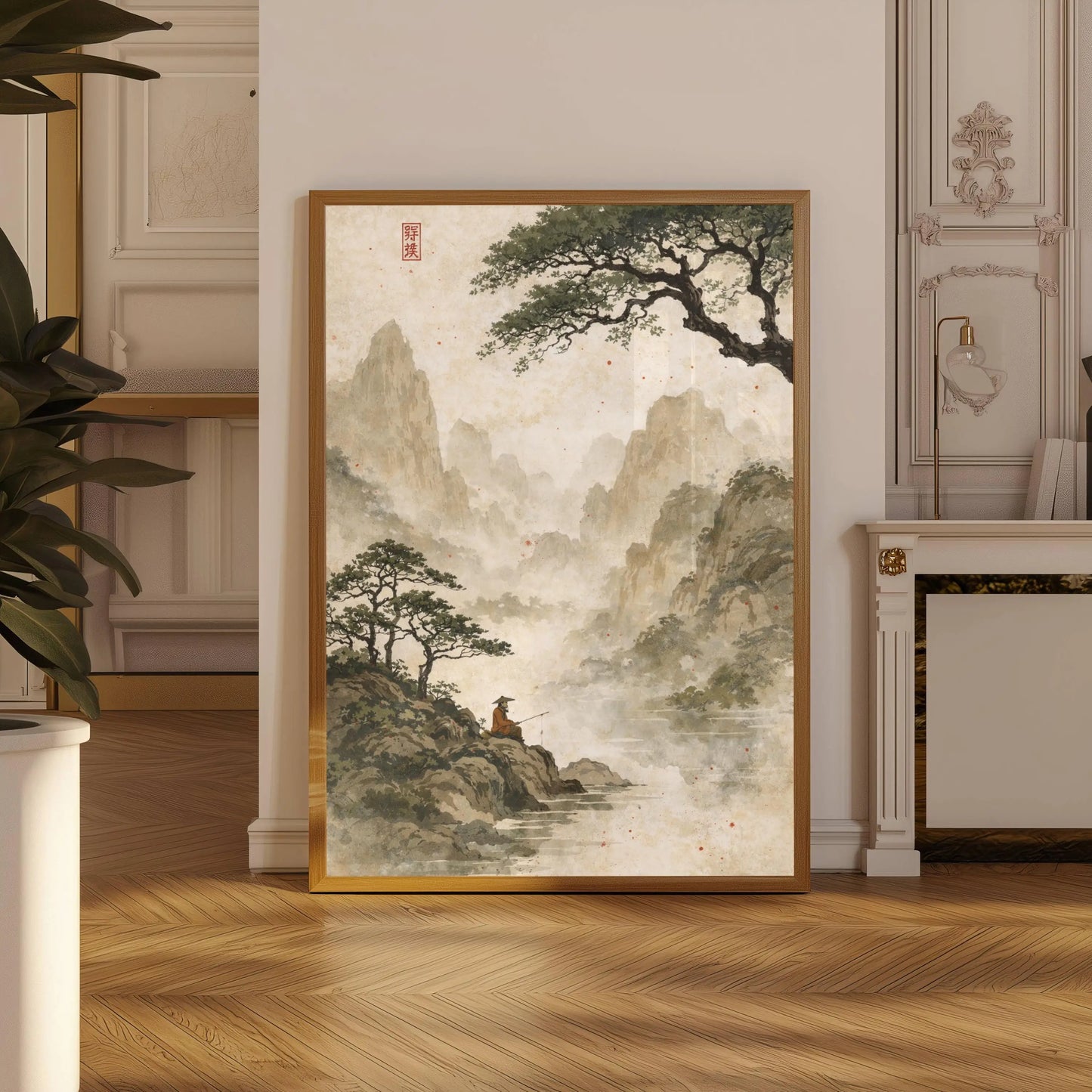Framed artwork of a mountain landscape with a person on a rock in a room with wooden flooring and decorative wall elements.
