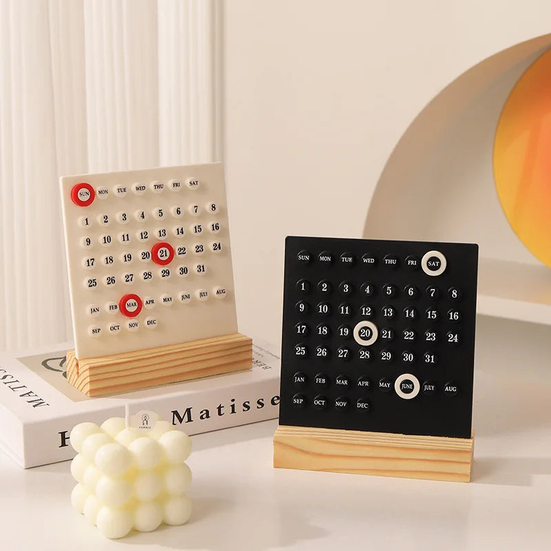 Modern perpetual desk calendar with wooden base, available in square and arch designs in black or white, minimalist desktop decor for home office and study spaces.