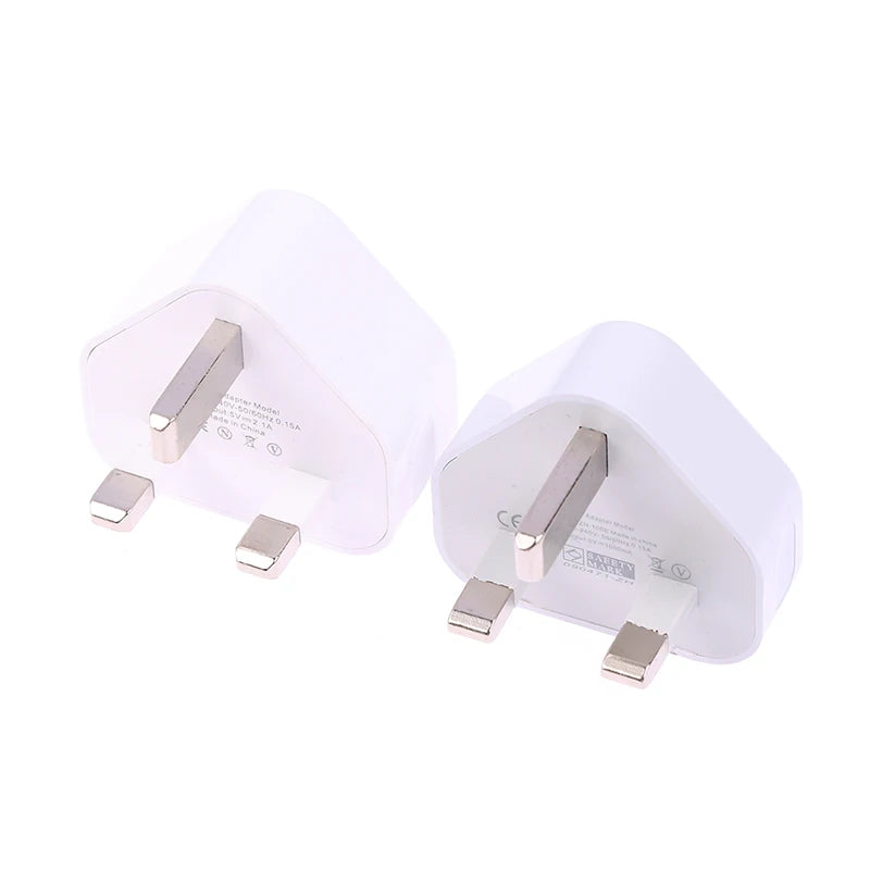 Two white electrical plugs on a white background
