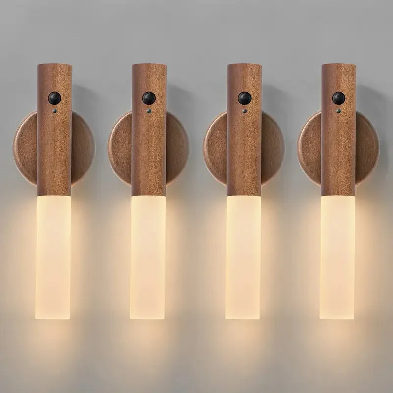 Four wooden wall sconces with light bulbs on a gray background