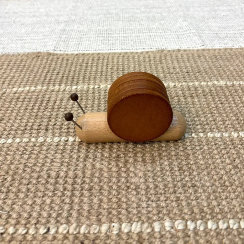 Wooden toycoaster set on a textured surface