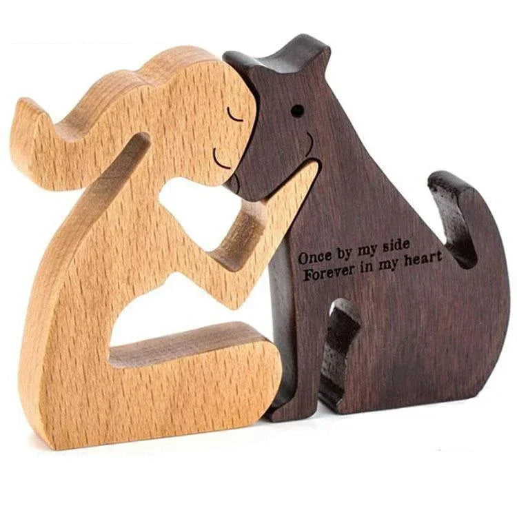 Two wooden sculptures of a couple hugging with engraved text on a white background