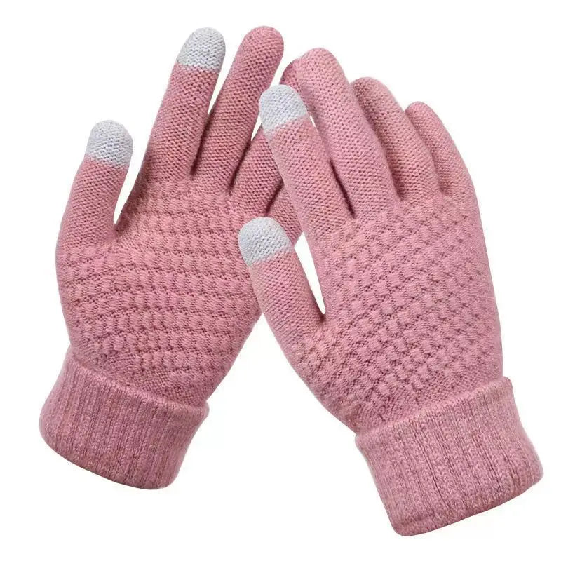 Pair of pink gloves with touchscreen tips on a white background