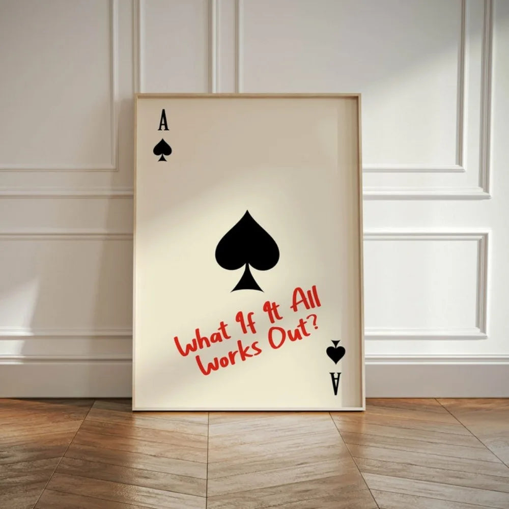 Framed artwork with a playing card design and text on a wall.
