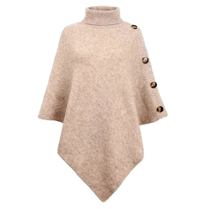Women’s oversized apricot poncho sweater with turtleneck and button sleeve detail styled with jeans