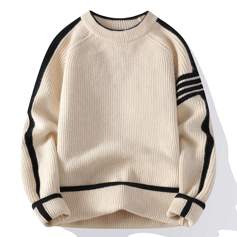 Beige sweater with black ribbed details on a white background