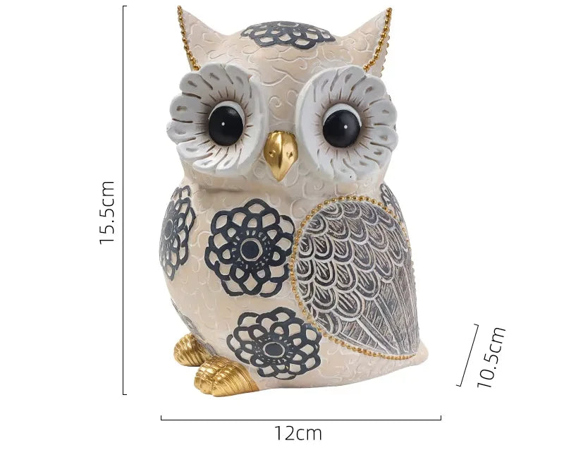 Decorative owl figurine with measurements on a white background