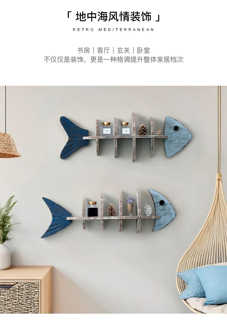 Two fish-shaped wall shelves on a wall with decorative items.