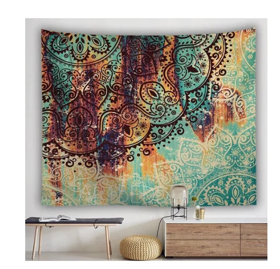 Colorful tapestry with intricate patterns hanging on a wall above a wooden dresser.
