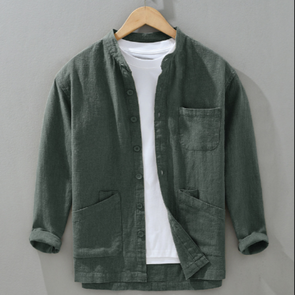 Green shirt with a white t-shirt underneath on a wooden hanger against a gray background