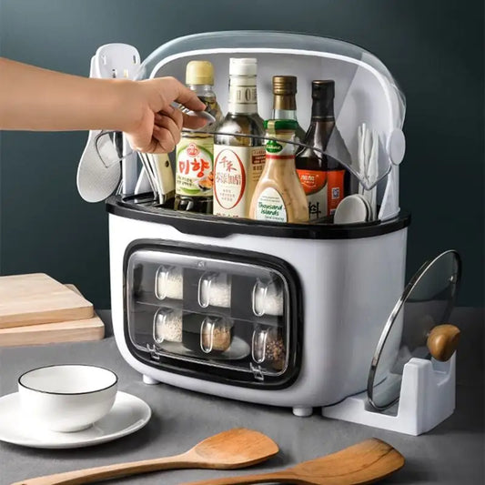 Kitchen organizer with bottles, spoons, and a bowl on a gray surface.