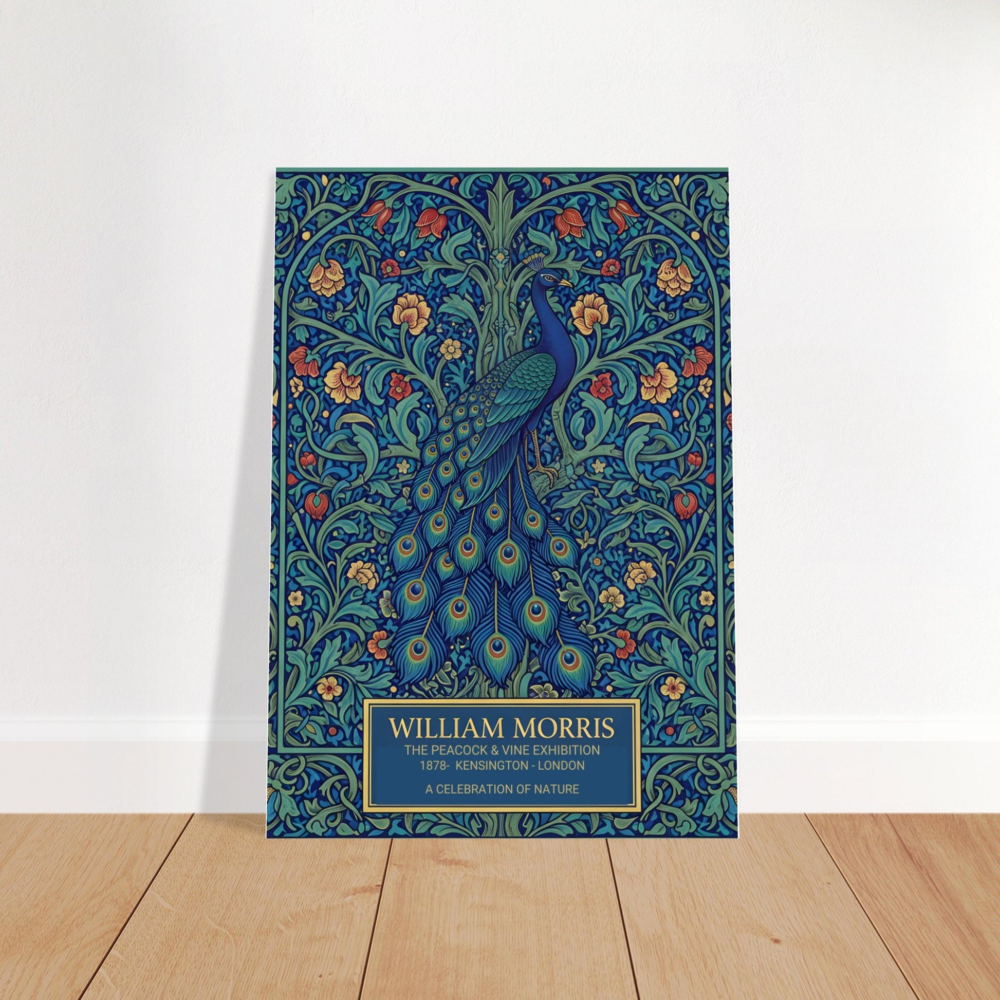 Vintage William Morris exhibition poster of a blue peacock with a long, detailed tail, surrounded by intricate green vines and orange flowers on a dark teal background. Cream-colored text at the bottom reads William Morris The Peacock and Vine Exhibition.