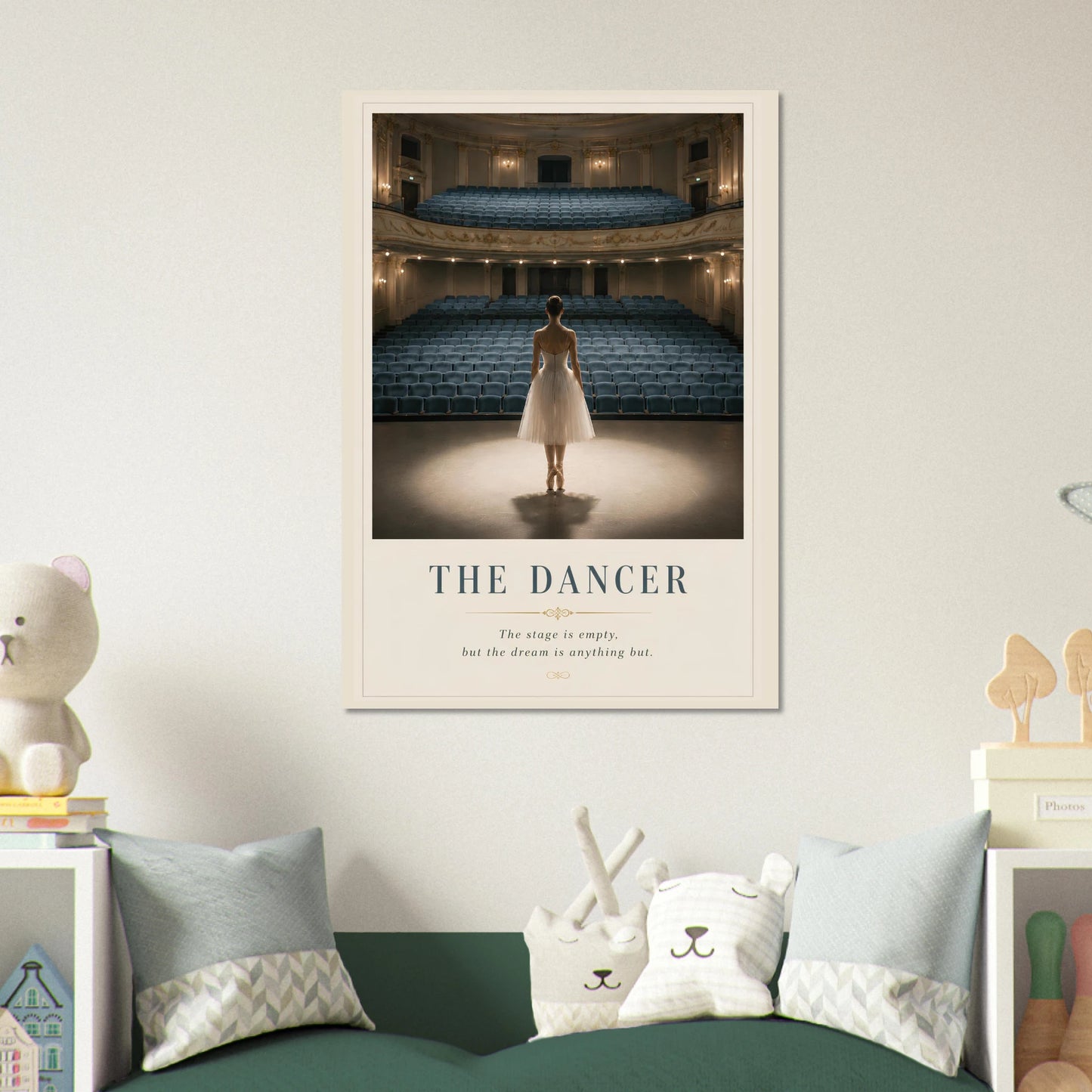 Framed artwork of a dancer in a theater on a wall above a bed with decorative pillows.