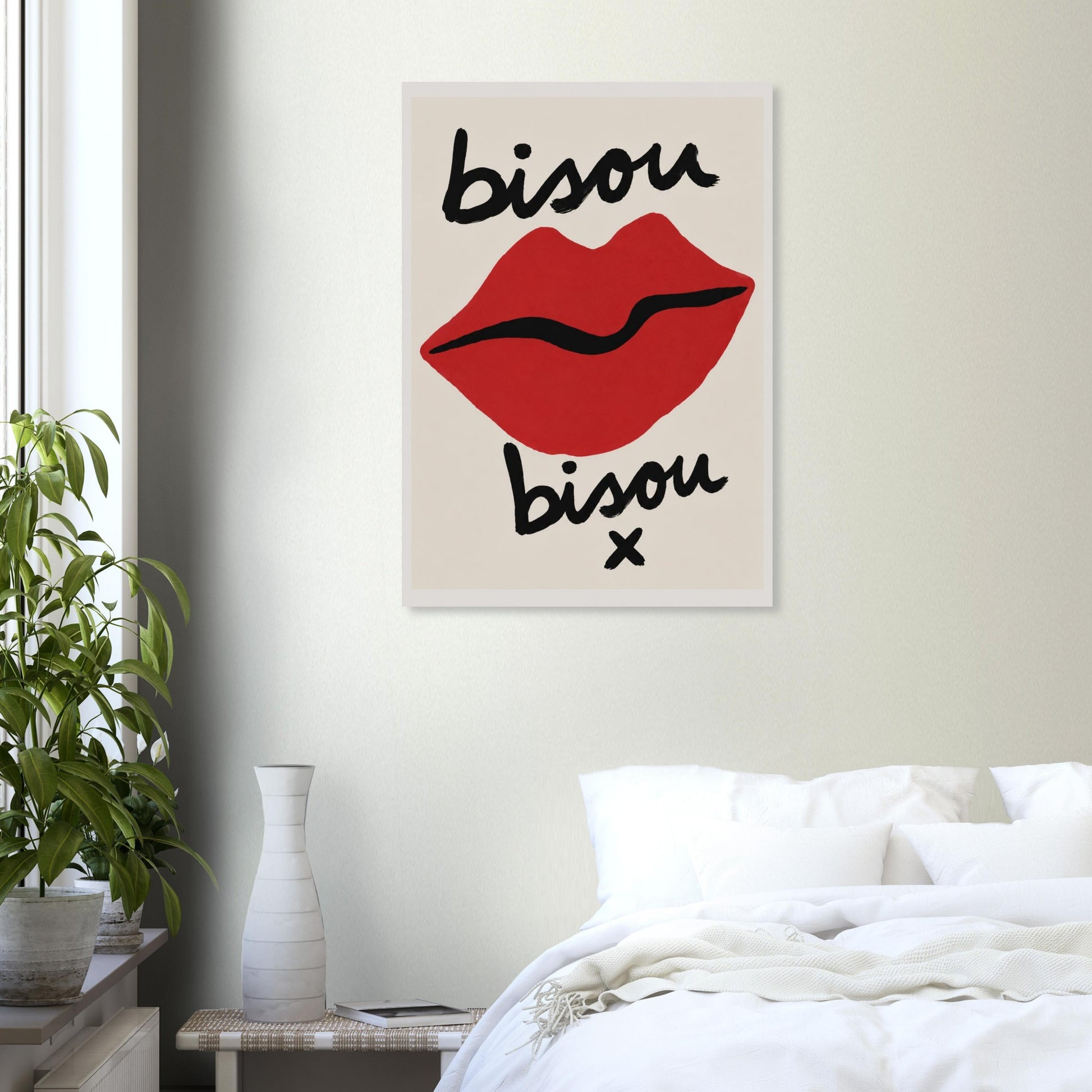 Framed artwork with red lips and 'bisou' text in a bedroom setting