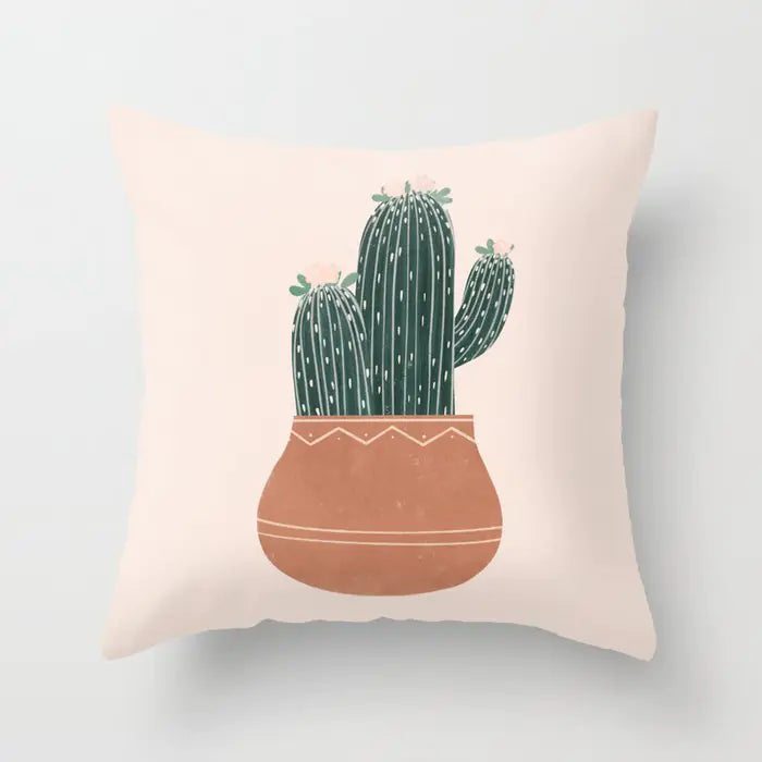 Decorative pillow with a cactus design on a light background