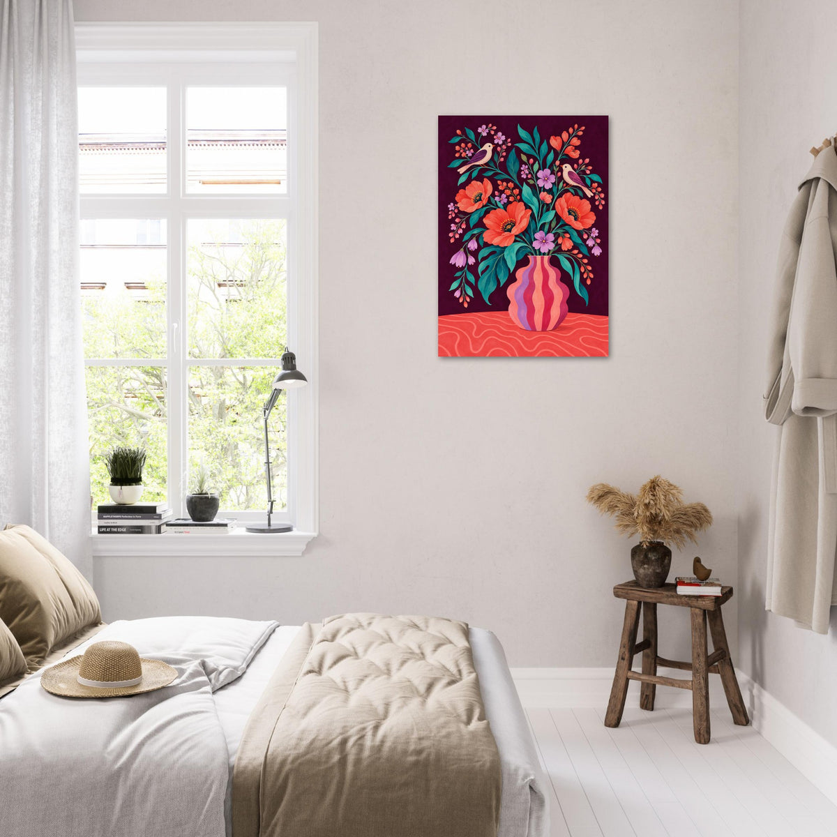 A colorful floral wall art print hanging on a white wall in a bright, modern bedroom. The print features a vibrant bouquet of orange, pink, and red flowers with green leaves in a pink vase against a dark purple background.